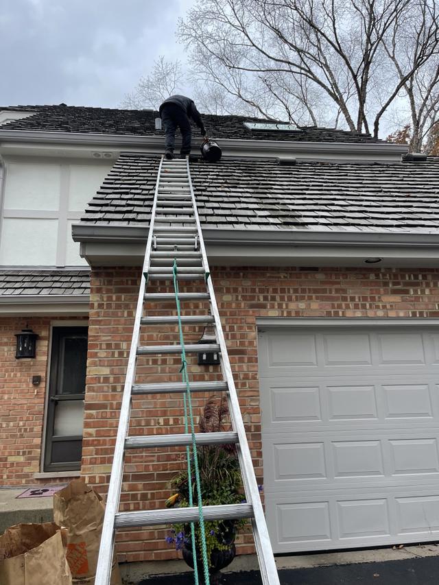 cleaning gutters of house